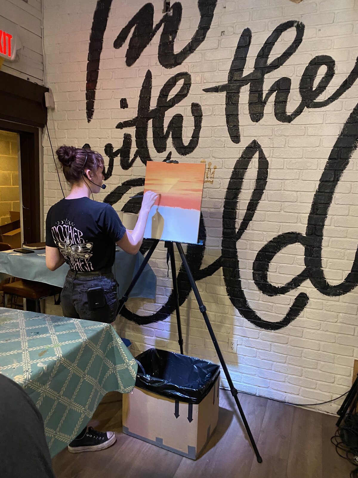 Amanda Ruby painting at an easel